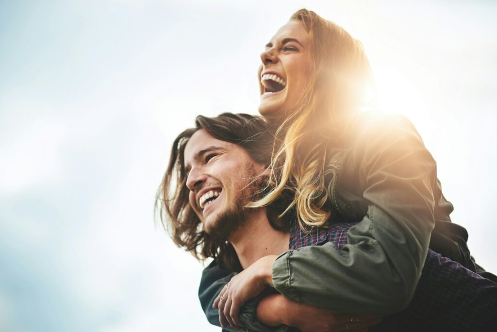 Live, laugh, love. Shot of a happy young couple having fun outside.